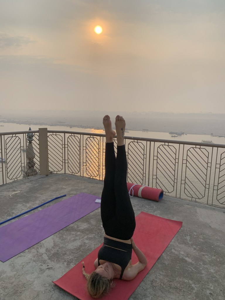 Yoga teacher Ayush student performing Sarvangasan in Varanasi. 
