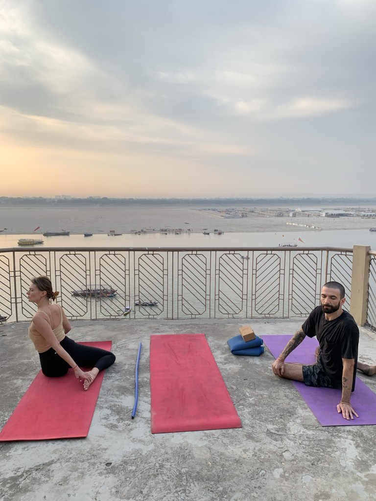 Yoga teacher Ayush students performing Spinal Twist Pose variation in Varanasi. 