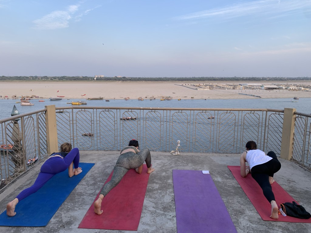 Yoga teacher Ayush students performing Dragon Pose in Varanasi. 